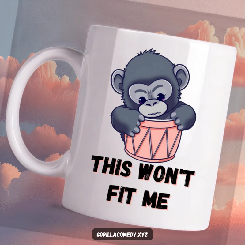 Funny curious gorilla mug showing a primate comically attempting to squeeze into a drum that is far too small.
