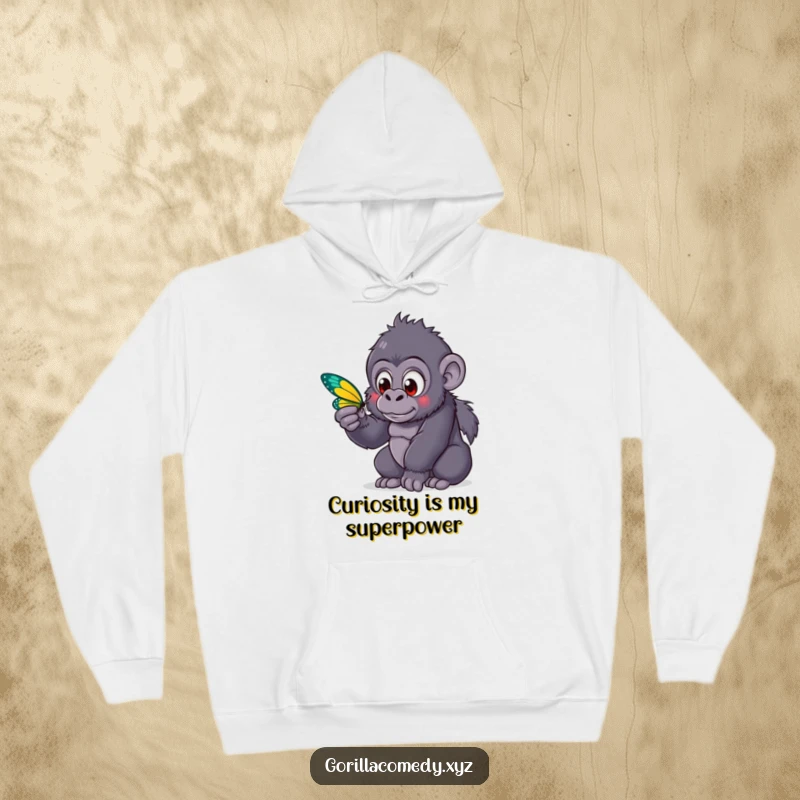A cute funny kawaii gorilla with wide, curious eyes is mesmerized by a colorful butterfly, showcased on a warm and cozy hoodie.