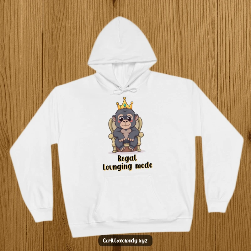 Funny hoodie depicting a gorilla adorned with a tiny crown, seated on a humble throne.