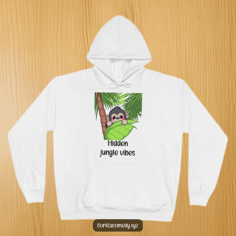 Funny Kawaii gorilla peeking from a large palm leaf, offering a cozy and humorous jungle vibe on a warm hoodie.