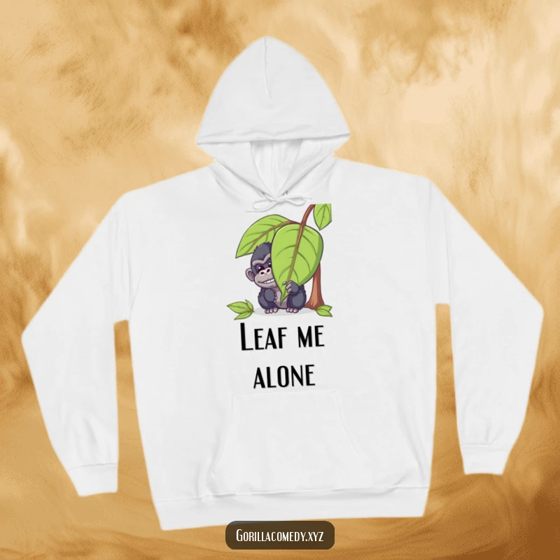 Funny gorilla hoodie featuring a mischievous ape character hiding behind a large leaf, peeking out with a chuckle, offering warmth and humorous style.
