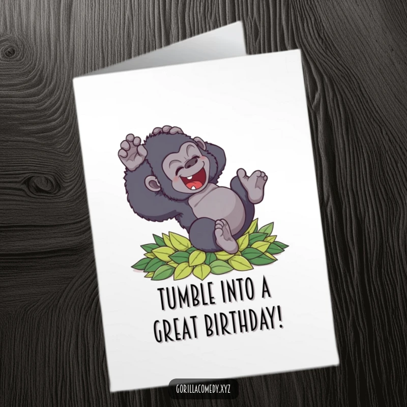 Funny Free Printable birthday card of a clumsy gorilla tumbling with delight into soft leaves, perfect for a humorous celebration.