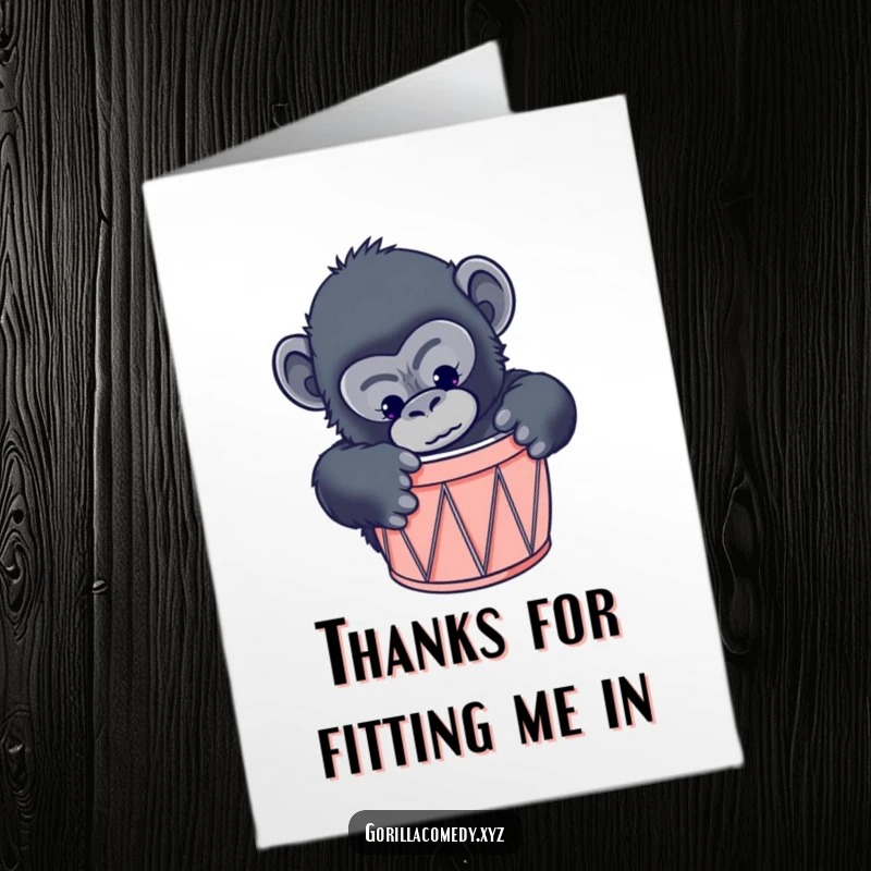 Funny free printable thank you card: curious gorilla attempting to fit into a miniature drum, looking comical.