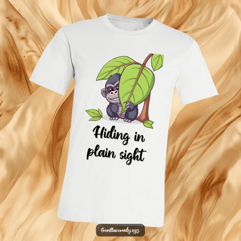 Funny gorilla t-shirt with a mischievous ape character hiding behind a big leaf, peeking out with a sly chuckle and playful eyes.