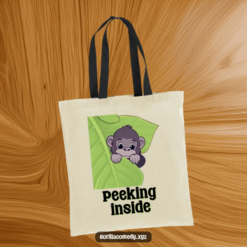 Funny tote bag featuring a gorilla peeking over a giant leaf, embodying curiosity and jungle exploration with a humorous touch.